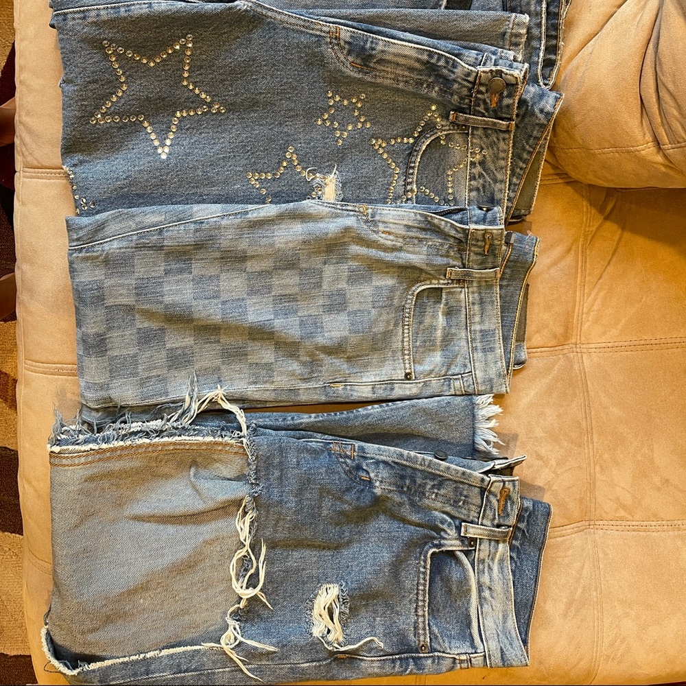 7 pairs of size 26 carmar denim jeans and 2 shorts